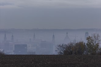 View from Dresden's Südhöhe of the city centre with its towers sinking into the fog