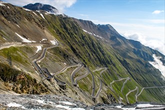 View of serpentines from north ramp Ascent from pass road to mountain pass Alpine pass with tight