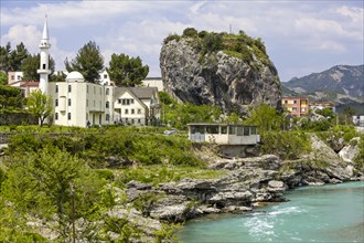 Town view of Përmet with cube-shaped rock Guri i Qytetit with wall remains from Ottoman times.