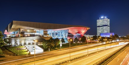 BMW World and the BMW four-cylinder administration building at night, Munich, Bavaria, Germany,