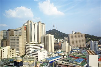 View of the houses of Seoul, in the back the N Seoul Tower on Namsan Hill or South Mountain,