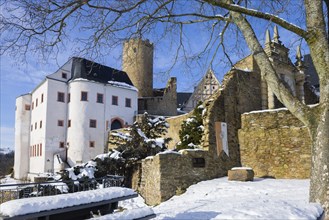 Scharfenstein Castle is a Spornburg on an elongated spur above the village of Scharfenstein