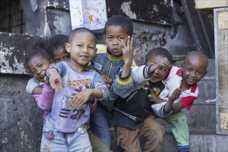 Smiling Malagasy children having fun posing in the streets of Antananarivo, capital city of