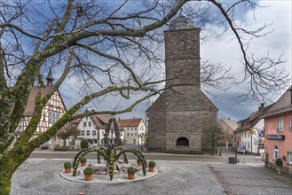 Town church, in front a decorated Easter fountain, Waldenburg, Baden-Württemberg, Germany, Europe