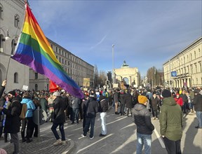 LGBTQ flag, crowd at the demonstration against right-wing extremism in front of the Siegestor in