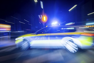 A police vehicle in action, with blue light switched on, Dresden, Saxony, Germany, Europe