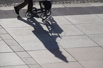 Passers-by with rollator, shadow, winter, Saxony, Germany, Europe