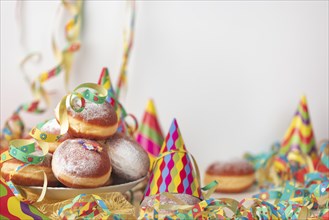 Colourful decoration and doughnuts, carnival table, copy room, white background