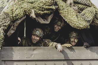 Czech soldiers drive through a forest as part of the military exercise 'Wettiner Schwert' with