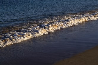 Sea, spray, waves, sandy beach, Meia Praia beach, Lagos, evening light, Atlantic Ocean, Algarve,