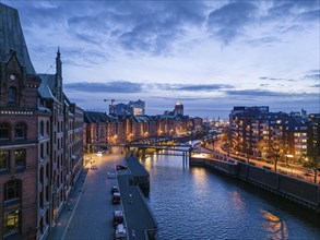 Aerial view of Speicherstadt Hamburg and the Elbe Philharmonic Hall with customs canal at blue