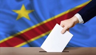 Presidential elections of the Democratic Republic of the Congo. Hand holding ballot in voting