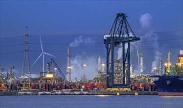 Container terminal showing wharf with stacked containers, gantry crane, portainer crane along the