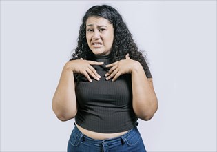 Young woman disgusted face isolated. Displeased young woman frowning on isolated background. People