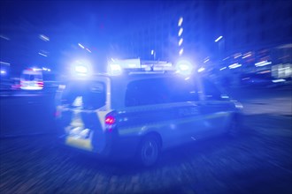 A police vehicle in action, with blue light switched on, Dresden, Saxony, Germany, Europe