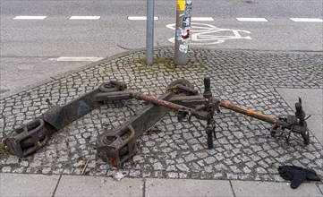 Rusty electric scooters on public streets, East Side Galery in Berlin-Mitte, Berlin, Germany,