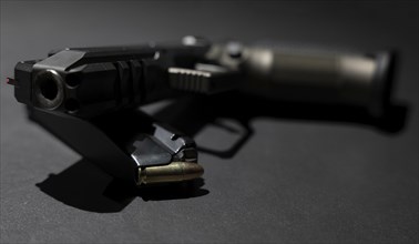 Modern Elegant Handgun and Bullet on Grey Background in Switzerland