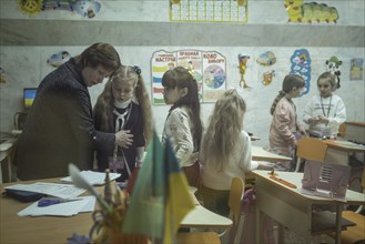 Pupils in a classroom in one of the metro schools in Kharkiv. Classrooms were set up in various