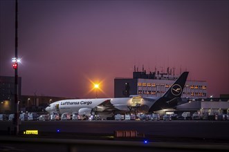 Lufthansa Cargo aircraft being loaded at the cargo centre, early in the morning at the airport in