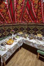 Interior photo, traditional yurt with food, Kyrgyzstan, Asia