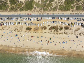 Beach life at the Atlantic Ocean near Punta Umbria. Aerial view. Drone shot. Huelva province,