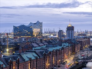 Aerial view of Speicherstadt Hamburg and the Elbe Philharmonic Hall with customs canal at blue