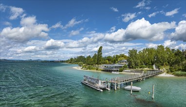 Aerial panorama of the Mettnau peninsula with the landing stage, restaurant and spa centre,