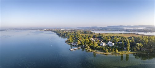 Aerial panorama of the Mettnau peninsula with the landing stage, solar ferry, restaurant and spa