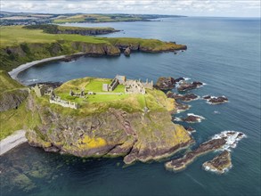 Aerial view of Dunnottar Castle ruins on the North Sea coast, Stonehaven, Aberdeenshire, Scotland,