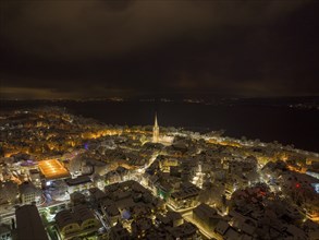 Aerial view, night view of the snow-covered and illuminated old town of Radolfzell on Lake