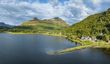 Aerial panorama of the freshwater loch Loch Leven with the former Pier House in the village of Glen