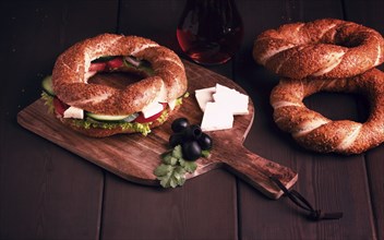 Traditional Turkish bagel simit, breakfast, on a wooden table, rustic, horizontal, no people