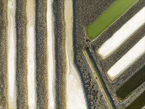 Saline ponds at the salt works near Chiclana de la Frontera. Aerial view. Drone shot. Cadiz