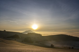 View from the old post road near Leipferdingen into the wintry and misty Hegaulandschaft at