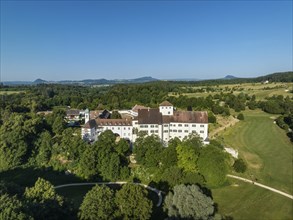 Aerial view of Langenstein Castle near Eigeltingen with surrounding golf course, on the horizon the