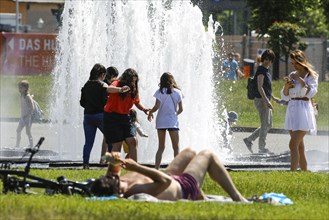 People enjoying the summer weather at Berlin's Lustgarten, 05/06/2021