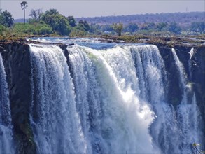 The Victoria Falls, Victoria Falls, a wide waterfall of the Zambezi River on the border of Zambia