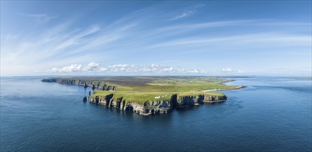 Aerial panorama of the rugged coastal landscape at Duncansby Head with the lighthouse, Duncansby