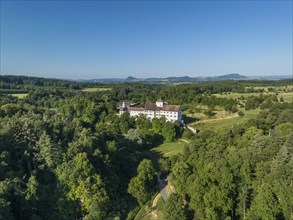 Aerial view of Langenstein Castle near Eigeltingen with surrounding golf course, on the horizon the