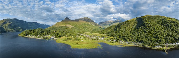 Aerial panorama of the freshwater loch Loch Leven with the village of Glen Coe, above it the 742