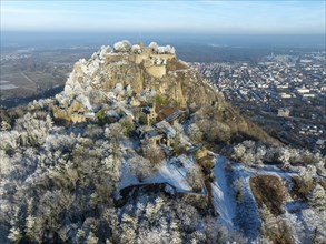 Aerial view of the snow-covered Hegau volcano Hohentwiel with Germany's largest castle ruins,