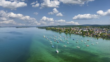 Aerial panorama of Lake Constance and the village of Allensbach, sailing boats parked in the shore