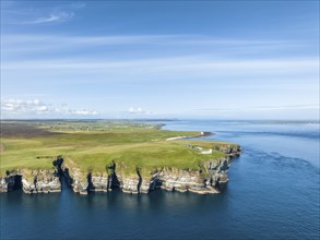 Aerial view of the rugged coastal landscape at Duncansby Head with the lighthouse, Scotland's