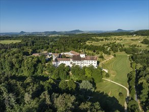 Aerial view of Langenstein Castle near Eigeltingen with surrounding golf course, on the horizon the