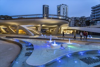 Modern architecture and colourfully lit fountains of Eleftheria Square at dusk, Nicosia, Cyprus,