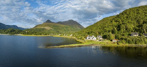 Aerial panorama of the freshwater loch Loch Leven with the former Pier House in the village of Glen