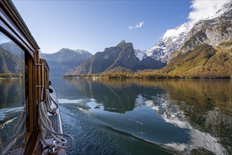 Tourist boat on the Königssee, Watzmann massif, autumnal mountain landscape reflected in the lake,