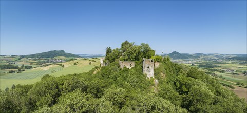 Aerial panorama of the Hegau volcano and the ruins of MÃ¤gdeberg Castle, on the horizon on the left