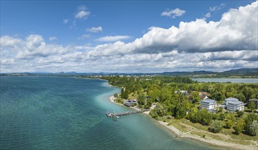 Aerial panorama of the Mettnau peninsula with the landing stage, restaurant and spa centre,