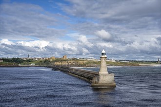 Tynemouth Lighthouse with the ruins of Tynemouth Priory and Castle behind, North Shields, Newcastle